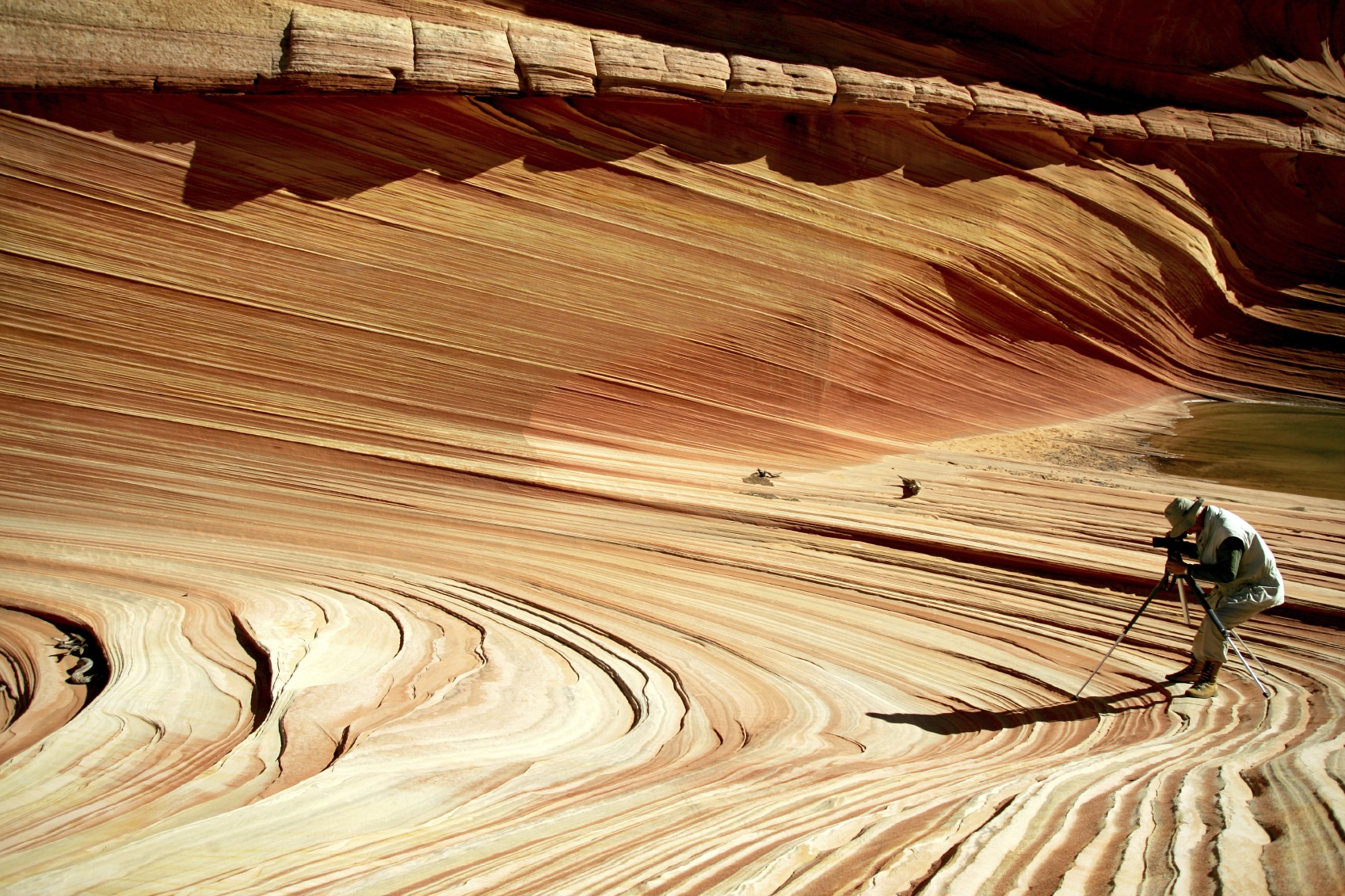 Photographer in desert landscape.